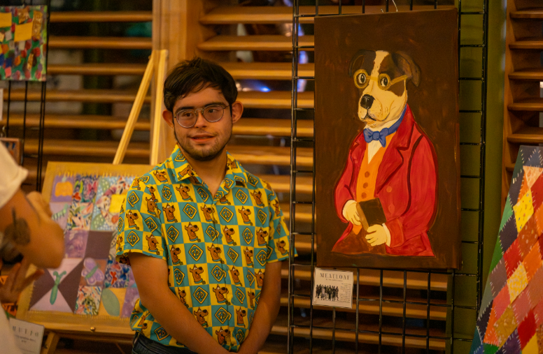 Tim with his dog painting, Yana Collective Icon